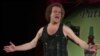 FILE - In this June 2, 2006, file photo, Richard Simmons speaks to the audience before the start of a summer salad fashion show at Grand Central Terminal in New York. 