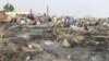 Vue générale des destructions causées par un incendie dans le camp de Muna Alamdiri, près de Maiduguri, le 15 novembre 2023. (Photo Audu MARTE / AFP)