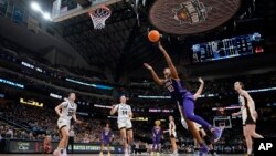 LSU's Angel Reese shoots during the second half of the NCAA Women's Final Four championship basketball game against Iowa, April 2, 2023, in Dallas. 