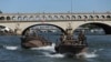 French soldiers patrol on the Seine river in Paris, July 17, 2024.