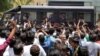 FILE PHOTO: A police van transports some of those convicted in connection with a riot in Gujarat in 2002, outside a court after a ruling in Ahmedabad, India June 2, 2016. 