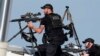 Police snipers return fire after shots were fired while Republican presidential candidate former President Donald Trump was speaking at a campaign event in Butler, Pennsylvania, July 13, 2024. 
