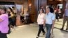 Cousins Ann Meddin Hellman, left, and Shalom Korai walk, talk, and hold hands after meeting in person for the first time in North Charleston, South Carolina, July 10, 2024.