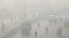 FILE - Vehicles move amid dense smog in Lahore, Pakistan, Nov. 24, 2021. According to a report published, March 14, 2023, by IQAir, a Swiss maker of air purifiers, Lahore has become the city with the worst air in the world in 2022.