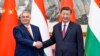 In this photo released by Xinhua News Agency, Hungarian Prime Minister Viktor Orban, left, shakes hands with Chinese President Xi Jinping before a meeting at the Diaoyutai State Guesthouse in Beijing, July 8, 2024. (Li Xueren/Xinhua via AP)