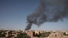 FILE - Smoke is seen in Khartoum, Sudan, April 19, 2023. Warring factions trying to seize control of the east African nation of Sudan have plunged the country into chaos. 