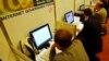 FILE - People use the internet during an internet governance forum in Rio de Janeiro, Brazil, Nov. 12, 2007.