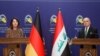 Germany's Foreign Minister Annalena Baerbock and Iraq's Foreign Minister Fuad Hussein attend a joint news conference in Baghdad, Iraq, March 7, 2023. 
