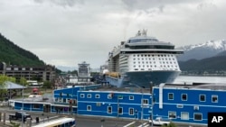 FILE - Cruise ships are docked on June 9, 2023, in downtown Juneau, Alaska. Voters in Alaska's capital city could decide in October whether to ban large cruise ships on Saturdays starting next year. 
