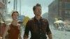 This image released by Universal Pictures shows Glen Powell, right, and Daisy Edgar-Jones in a scene from "Twisters." (Universal Pictures via AP)