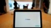 FILE - A Meta Portal Go is displayed at a Meta Store in Burlingame, Calif., May 4, 2022. There has been a marked rise in sextortion cases in recent years, fueled in part by a loosely organized group called the Yahoo Boys, operating mainly out of Nigeria, Meta said. 