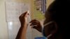 FILE - A nurse fills a syringe with malaria vaccine before administering it to an infant at the Lumumba Sub-County hospital in Kisumu, Kenya, July 1, 2022. Nigeria announced April 17, 2023, that it has given provisional approval to Oxford University's new R21 malaria vaccine. 