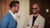 Andrew Tate, right, smiles while waiting along with his brother Tristan for a hearing inside the Court of Appeals building in Bucharest, Romania, June 26, 2024. 