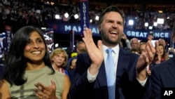 FILE - Republican vice presidential candidate Sen. J.D. Vance, R-Ohio, and his wife Usha Chilukuri Vance arrive on the floor during the first day of the 2024 Republican National Convention at the Fiserv Forum, in Milwaukee, July 15, 2024. 