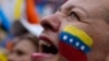 A supporter of opposition presidential candidate Edmundo Gonzalez cheers as thousands await his arrival at a campaign rally in Barinas, Venezuela, July 6, 2024. 