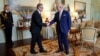 Britain's King Charles III, right, shakes hands with Keir Starmer where he invited the Labour Party leader to become prime minister and to form a new government, following the general election victory for the Labour Party, in London, July 5, 2024.