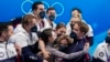 FILE - Madison Chock and Evan Bates, of the United States, reacts after the team ice dance program during the figure skating competition at the 2022 Winter Olympics, Feb. 7, 2022, in Beijing.