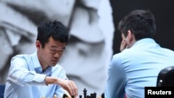 Ding Liren of China competes against Ian Nepomniachtchi at FIDE World Chess Championship in Astana, Kazakhstan, Apr. 30, 2023. 