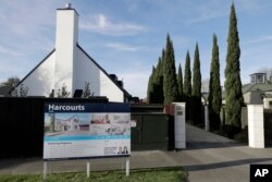 FILE - A house is for sale in Christchurch, New Zealand, Aug. 13, 2018.