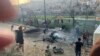 Residents rush to help injured children moments after a rocket attack hit a soccer field in the Druze town of Majdal Shams in the Israeli-controlled Golan Heights, July 27, 2024.