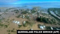 This handout photo taken on March 10, 2023 and received on March 11, 2023 from the Queensland Police Service shows an aerial view of the flooded northern Queensland town of Burketown.