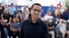 Director Lou Ye is pictured during a photo call for the film "An Unfinished Film," presented as part of Special Screenings at the 77th Cannes Film Festival in Cannes, France, May 17, 2024.