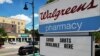 FILE - Papan iklan suntik vaksin COVID-19 di Walgreens Pharmacy, Somerville, Massachusetts, 14 Agustus 2023.