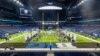Players and coaches talk with reporters during an NCAA college football news conference at the Big Ten Conference media days at Lucas Oil Stadium, July 24, 2024, in Indianapolis.
