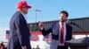 FILE - Sen. J.D. Vance, right, points toward Republican presidential candidate former President Donald Trump at a campaign rally, March 16, 2024, in Vandalia, Ohio. Trump on Monday picked Vance as his running mate.