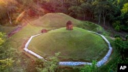 FILE - An aerial view of the Moidams burial mounds in Charaideo, in upper Assam, India, Sept. 27, 2022. The Charaideo Moidam royal burial complex and shrines, built by northeast India's Ahom dynasty, has been inscribed as a new World Heritage Site.