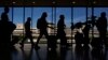 Travelers walk through the Philadelphia International Airport, July 3, 2024. 
