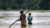 Banjir di desa Bali, sebelah barat Guwahati, India, Jumat, 23 Juni 2023. Puluhan ribu orang mengungsi ke kamp-kamp bantuan setelah banjir melanda sebagian besar desa di Wilayah timur laut India yang terpencil minggu ini. (AP/Anupam Nath)