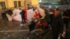 Protesters gather in front of police officers during a rally against the "foreign agents" law in Tbilisi, Georgia, March 7, 2023.