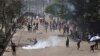 Students clash with riot police during a protest against a quota system for government jobs in Dhaka, Bangladesh, July 18, 2024.