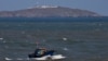 A Chinese fishing boat sails across the Taiwan Strait near the Taiwan-controlled Niushan Island, off Pingtan Island, Fujian province, China, April 9, 2023.
