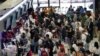 Passengers line up for check in at Don Mueang International Airport in Bangkok, Thailand, July 19, 2024. 