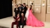 Daniel Kwan, Daniel Scheinert and Jonathan Wang pose with the Oscar for Best Picture for "Everything Everywhere All at Once" along with cast Jamie Lee Curtis, Ke Huy Quan, Michelle Yeoh, Stephanie Hsu and James Hong at the 95th Academy Awards in Los Angeles, March 12, 2023. 