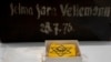 Yellow badges and a piece of luggage are displayed at Yad Vashem World Holocaust Remembrance Center in Jerusalem, July 8, 2024.