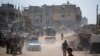 Palestinians displaced by the Israeli air and ground offensive on the Gaza Strip flee from parts of Khan Younis following an evacuation order by the Israeli army to leave the eastern part of Gaza Strip's second largest city, July 22, 2024. 