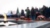 FILE - Mourners gather to lay flowers in memory of more than 60 Russian soldiers that Russia says were killed in a Ukrainian strike on Russian-controlled territory, in Samara, on Jan. 3, 2023. 