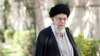 In this picture released by the official website of the office of the Iranian supreme leader, Supreme Leader Ayatollah Ali Khamenei speaks after planting a tree near his office, March 6, 2023. He said the recent poisoning of Iranian schoolgirls was an "unforgivable" crime. 