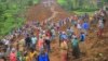People are seen gathered at the site of a landslide in Gofa Zone, southern Ethiopia, July 22, 2024. (Isayas Churga/Gofa Zone Government Communication Affairs Department via AP)