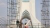 Iranian workers toil during the heat surge in Tehran, Iran, on July 21, 2024. (West Asia News Agency via Reuters)