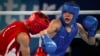 In this photo provided by the International Olympic Committee, Maksym Halinichev of Ukraine, right, competes against Abdumalik Khalokov of Uzbekistan during the Youth Olympic Games in Buenos Aires, Argentina, Oct. 18, 2018. 