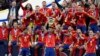 Spain's Alvaro Morata holds the trophy as he celebrates with his teammates after winning the final match between Spain and England at the Euro 2024 soccer championship in Berlin, Germany, July 14, 2024.