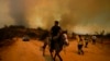 Chile accuses volunteer firefighter, ex-forestry official with causing blaze that killed 137