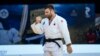 FILE - Arman Adamian of Russia celebrates a win during the men's - 100kg final match at the Grand Slam Paris 2021 Judo tournament, in Paris, France, Oct. 17, 2021.