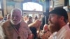 Stephen Hemingway Adams, right, a great-grandson of Ernest Hemingway, speaks with 2023 Hemingway Look-Alike Contest winner Gerrit Marshall at Sloppy Joe's Bar in Key West, Florida, July 17, 2024.