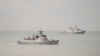 Dua kapal milik Angkatan Laut China tampak bergerak meninggalkan Serat Torres menuju Laut Coral, Australia, pada 18 Februari 2022. (Foto: Handout/Australian Defence Force/AFP)