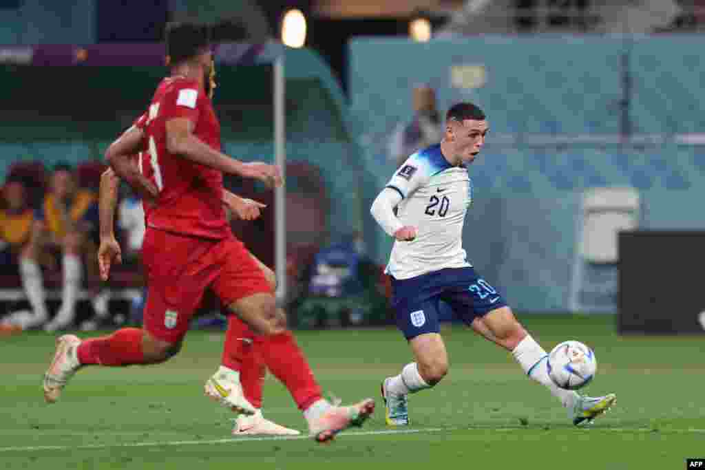 Attaquant ya Grande-Bretagne @20 Phil Foden abeti ndembo na match ya groupe B ya Mondial Qatar 2022 na Iran, na stade Khalifa, Doha, 21 novembre 2022. (Photo Giuseppe CACACE / AFP)